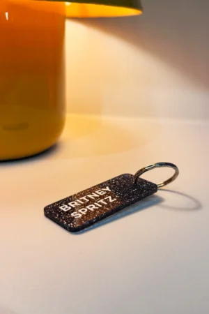 Porte-clés pailleté 'Britney Spritz' Noir | PLUS DE LOVE